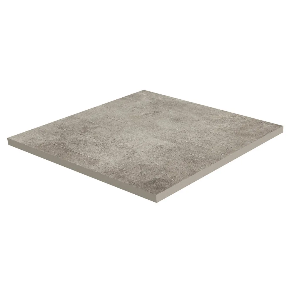 Štvorcová dlaždica Grey Soul Dark v rozmere 122 × 122 cm fotená pod uhlom na bielom pozadí. Zboku vidno hrúbku dvoch centimetrov, teda profil, ktorý sa kladie nasucho na výškovo nastaviteľné terče.